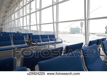 A waiting area inside the Hong Kong International Airport, also known as the Chek Lap Kok Airport, Hong Kong View Large Photo Image Stock Photography - A waiting area inside the Hong Kong International Airport, also known as the Chek Lap Kok Airport, Hong Kong. Fotosearch