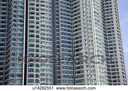 Stock Image - Apartment building windows in Tung Chung, Hong Kong. Fotosearch