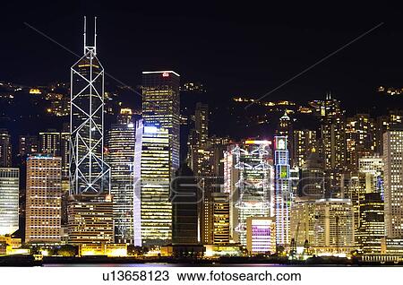 Stock Image - Cityscape in Central at night, Hong Kong. Fotosearch