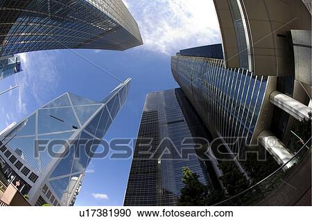 Stock Image - Daytime view of tall buildings in Central, Hong Kong, Fisheye Lens, Low angle view. Fotosearch