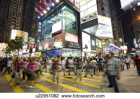Stock Image - People walking in front of a department store, Causeway Bay (Tung Lo Wan), Hong Kong. Fotosearch