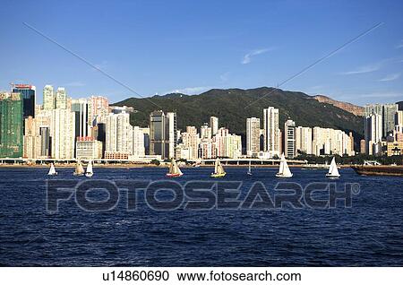Stock Image - Sailboats in Victoria Harbor, Hong Kong. Fotosearch