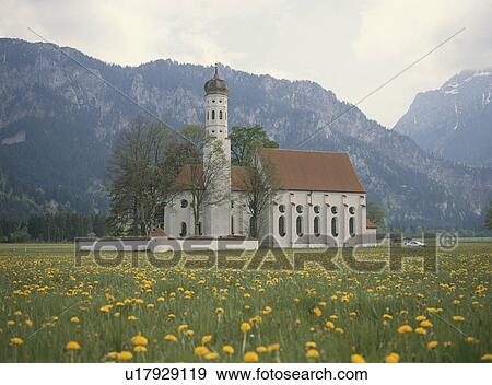 Stock Photo - The Church In A Dandelion Field. Fotosearch