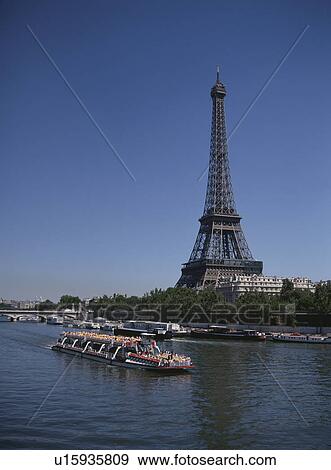 The Eiffel Tower And A Boat In Paris, France View Large Photo Image Stock Photo - The Eiffel Tower And A Boat In Paris, France. Fotosearch