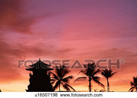 Stock Photo - Pagoda And Palms At Sunset. Fotosearch