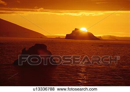 Sun Setting Behind Iceberg View Large Photo Image Stock Photo - Sun Setting Behind Iceberg. Fotosearch