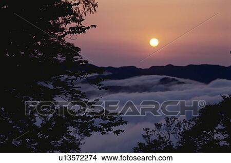 The Morning Sun And A Mountain Range View Large Photo Image Picture - The Morning Sun And A Mountain Range. Fotosearch