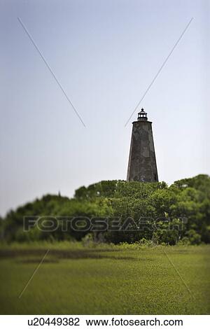 Stock Image - Bald Head Island lighthouse on Bald Head Island, North Carolina.. Fotosearch