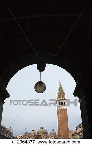 Campanile in Piazza San Marco in Venice, Italy viewed from arched doorway. View Large Photo Image Stock Photo - Campanile in Piazza San Marco in Venice, Italy viewed from arched doorway.. Fotosearch