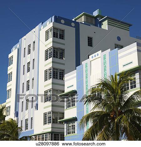Stock Photograph - Palm trees and buildings in art deco district of Miami, Florida, USA.. Fotosearch