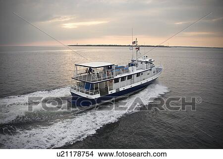 Picture - Passenger ferry crossing sea at Bald Head Island, North Carolina. . Fotosearch