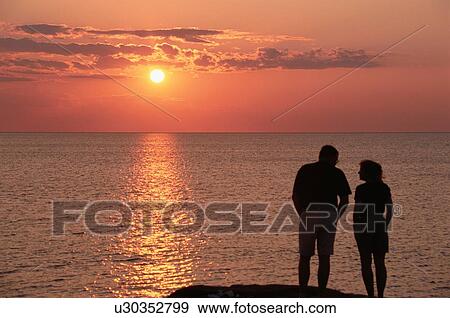 Couple Watching Sunset View Large Photo Image Stock Photo - Couple Watching Sunset. Fotosearch