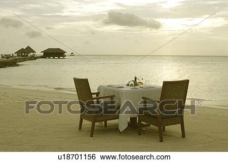 Stock Photograph - Dinner With The Setting Sun. Fotosearch