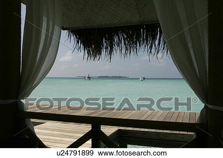 Stock Photo - The Blue Lagoon Overlooking From A Cottage. Fotosearch