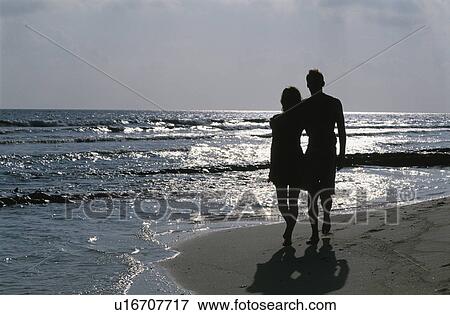 Stock Photo - The Couple On The Beach. Fotosearch