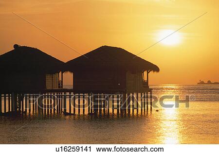 The Silhouette Of The Setting Sun And The Cottage View Large Photo Image Stock Image - The Silhouette Of The Setting Sun And The Cottage. Fotosearch