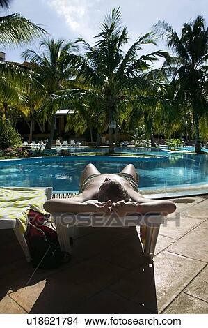 Sunbathing in a Varadero resort, Cuba View Large Photo Image Picture - Sunbathing in a Varadero resort, Cuba. Fotosearch