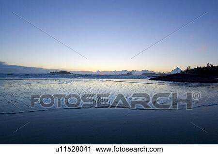 Stock Image - Sunset, Chesterman Beach, Tofino, Vancouver Island, BC. Fotosearch