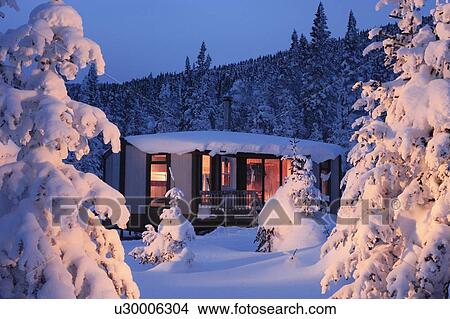 View of La Mesange shelter and snow-covered trees at twilight, Quebec, Canada. View Large Photo Image Picture - View of La Mesange shelter and snow-covered trees at twilight, Quebec, Canada.. Fotosearch