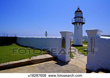 Stock Photo - The lighthouse and the white wall in Penghu, Taiwan. Fotosearch