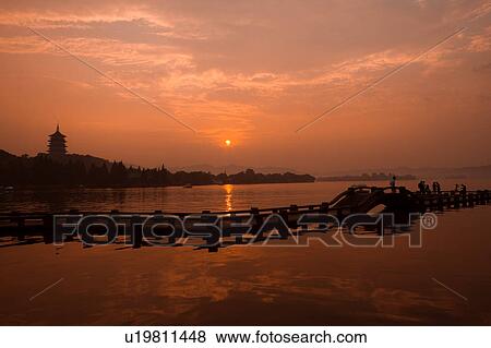Stock Photo - Leifeng Pagoda in Evening Glow in west lake, Hangzhou, Zhejiang Province. Fotosearch