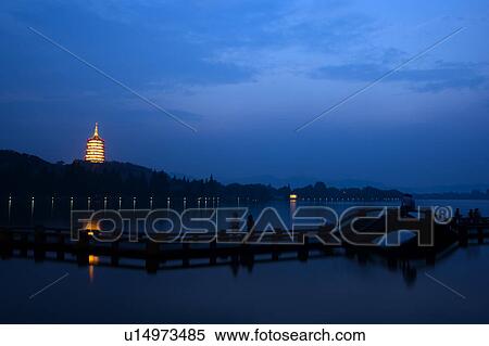 Leifeng Pagoda in west lake at night, Hangzhou, Zhejiang Province View Large Photo Image Stock Photography - Leifeng Pagoda in west lake at night, Hangzhou, Zhejiang Province. Fotosearch