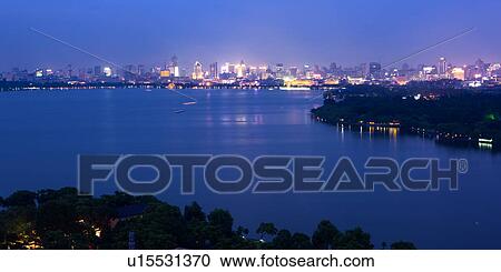 Scenery of west lake at night, Hangzhou, Zhejiang Province View Large Photo Image Stock Image - Scenery of west lake at night, Hangzhou, Zhejiang Province. Fotosearch
