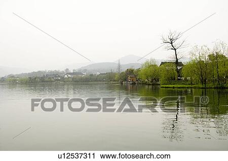 Stock Image - Scenery of West Lake in Hangzhou, Zhejiang Province. Fotosearch