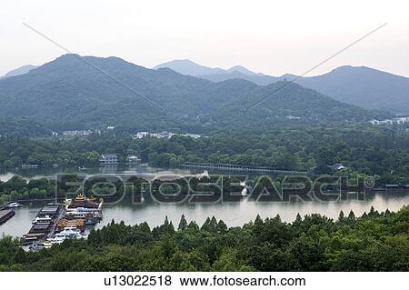 Su causeway in West Lake, Hangzhou, Zhejiang Province View Large Photo Image Stock Photo - Su causeway in West Lake, Hangzhou, Zhejiang Province. Fotosearch