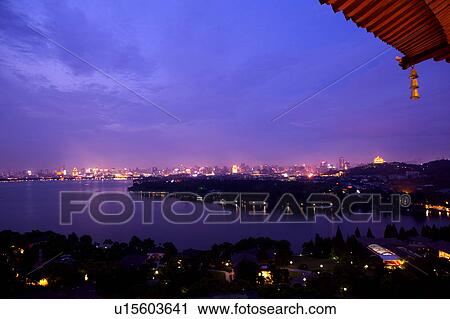 Stock Image - The scenery of West Lake at night, Hangzhou, Zhejiang Province. Fotosearch