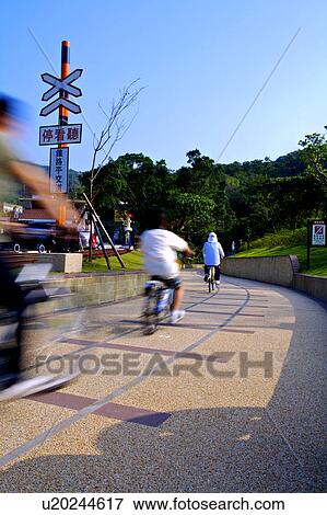 People cycling in Fulong Village, Gongliao Township, Taipei County, Taiwan View Large Photo Image Stock Photo - People cycling in Fulong Village, Gongliao Township, Taipei County, Taiwan. Fotosearch