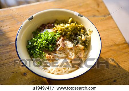Stock Photo - Close-up of a bowl of Guilin rice noodle on the table. Fotosearch