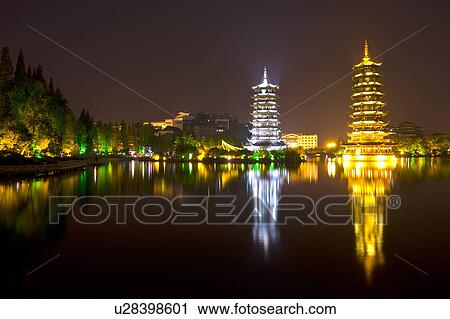 Illuminated Twins Tower at night in Guilin, Guangxi Province, China View Large Photo Image Stock Image - Illuminated Twins Tower at night in Guilin, Guangxi Province, China. Fotosearch