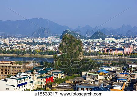 Urban scene and Solitary Beauty Peak in Guilin, Guangxi Province, China View Large Photo Image Stock Photo - Urban scene and Solitary Beauty Peak in Guilin, Guangxi Province, China. Fotosearch