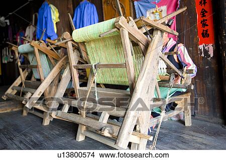 China, Guangxi Province, Guilin, Yangshuo, people using the loom in the house View Large Photo Image Picture - China, Guangxi Province, Guilin, Yangshuo, people using the loom in the house. Fotosearch