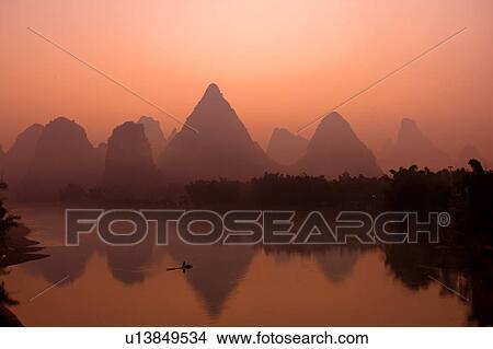 Picture - China, Guangxi Province, Guilin, Yangshuo, Li River with mountains. Fotosearch