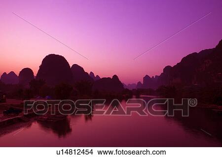 Picture - China, Guangxi Province, Guilin, Yangshuo, Yulong River at sunset. Fotosearch