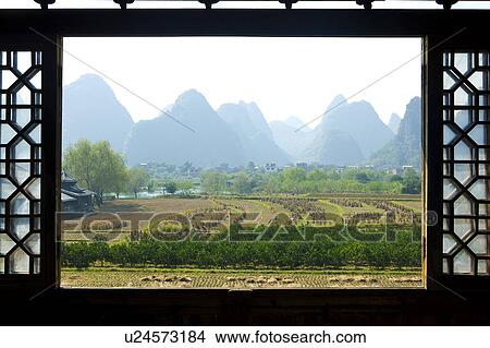 China, Guangxi Province, Guilin, Yangshuo, farmlands with mountain View Large Photo Image Picture - China, Guangxi Province, Guilin, Yangshuo, farmlands with mountain. Fotosearch