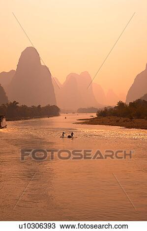 Stock Image - China, Guangxi Province, Guilin, Yangshuo, Li river and mountains. Fotosearch