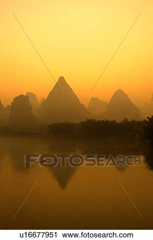 China, Guangxi Province, Guilin, Yangshuo, Li River with mountains at sunrise View Large Photo Image Stock Image - China, Guangxi Province, Guilin, Yangshuo, Li River with mountains at sunrise. Fotosearch