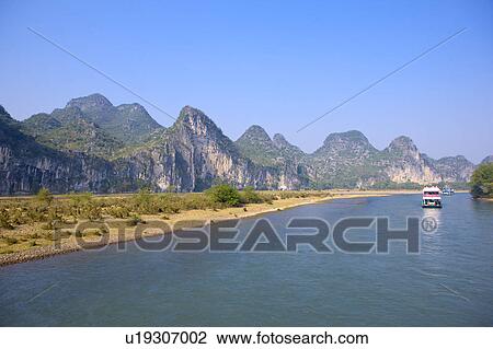 China, Guangxi Province, Guilin, Yangshuo, Li River with mountains View Large Photo Image Stock Image - China, Guangxi Province, Guilin, Yangshuo, Li River with mountains. Fotosearch