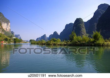 Stock Image - China, Guangxi Province, Guilin, Yangshuo, Li river and mountains. Fotosearch