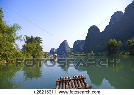 China, Guangxi Province, Guilin, Yangshuo, wooden raft on Yulong River View Large Photo Image Stock Image - China, Guangxi Province, Guilin, Yangshuo, wooden raft on Yulong River. Fotosearch