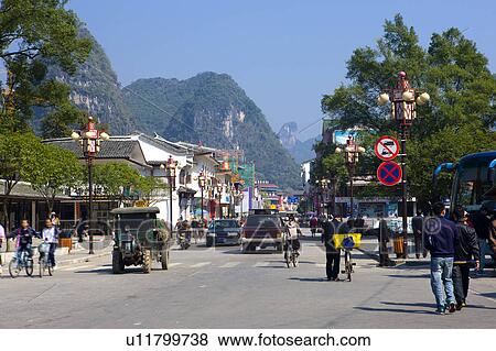 Stock Photo - China, Guangxi Province, Guilin, Yangshuo, people in street. Fotosearch