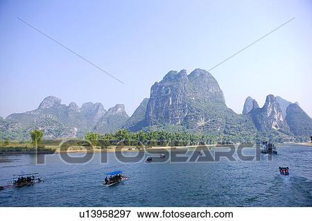 China, Guangxi Province, Guilin, Yangshuo, boats on Li River View Large Photo Image Stock Photo - China, Guangxi Province, Guilin, Yangshuo, boats on Li River. Fotosearch