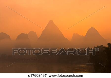Stock Photo - China, Guangxi Province, Guilin, Yangshuo, Li River, Yangshuo Sunrise. Fotosearch