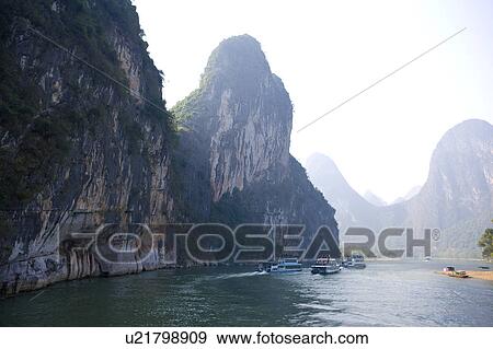 China, Guangxi Province, Guilin, Yangshuo, river traffic on Li River View Large Photo Image Stock Photo - China, Guangxi Province, Guilin, Yangshuo, river traffic on Li River. Fotosearch