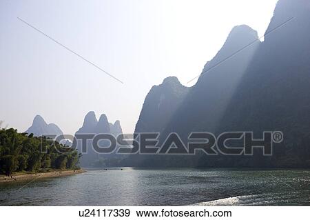 China, Guangxi Province, Guilin, Yangshuo, Li river and mountains View Large Photo Image Stock Photo - China, Guangxi Province, Guilin, Yangshuo, Li river and mountains. Fotosearch