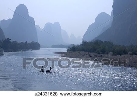 China, Guangxi Province, Guilin, Yangshuo, people on the boat in Li River View Large Photo Image Stock Photo - China, Guangxi Province, Guilin, Yangshuo, people on the boat in Li River. Fotosearch
