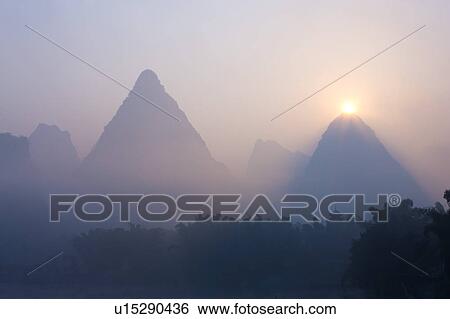 China, Guangxi Province, Guilin, Yangshuo, mountains at sunrise View Large Photo Image Stock Photograph - China, Guangxi Province, Guilin, Yangshuo, mountains at sunrise. Fotosearch